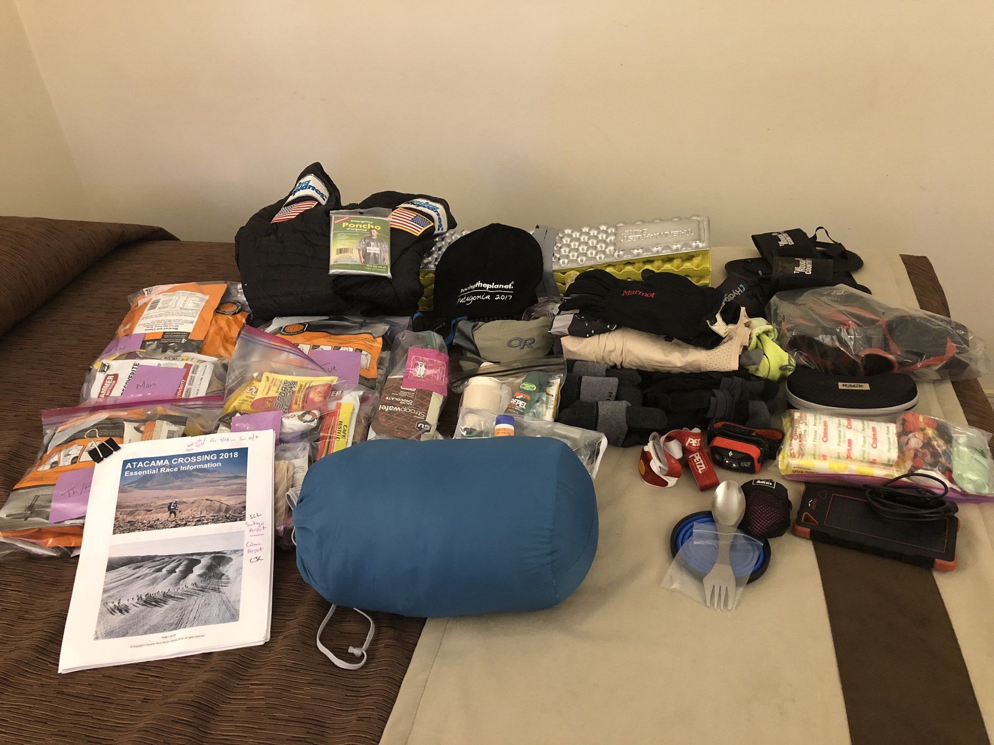 All of the race gear laid out on a bed before packing, Atacama 2018
